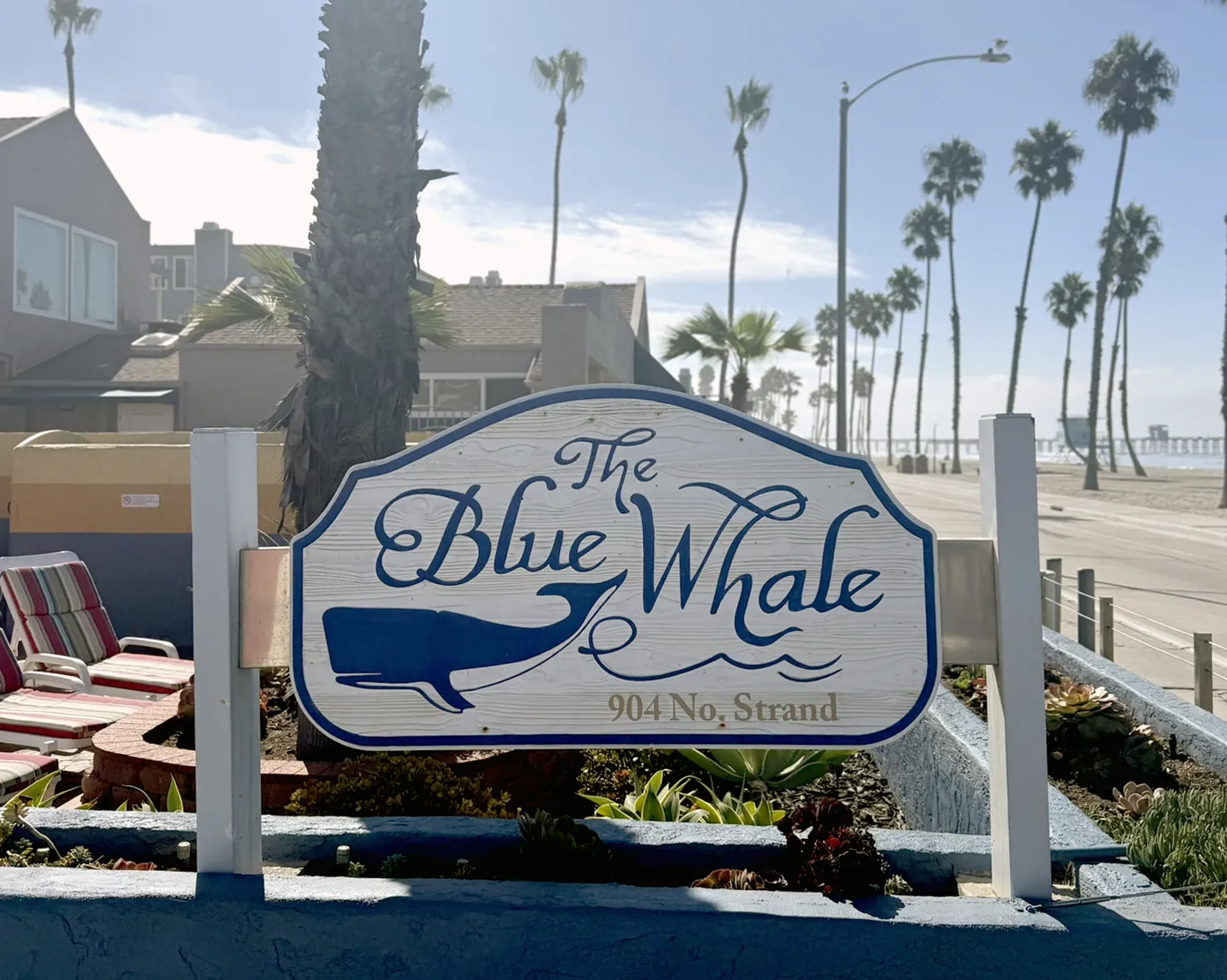 The Blue Whale logo in front of the resort